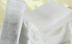 White fill-your-own tea filter bag with drawstring for loose tea and herbs