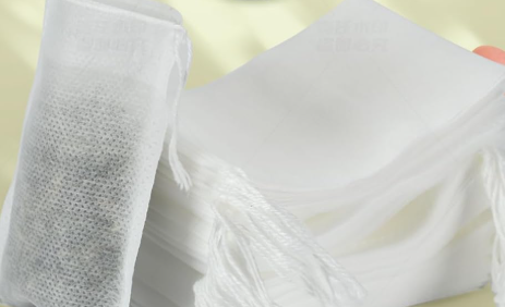 White fill-your-own tea filter bag with drawstring for loose tea and herbs