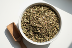 Dried Red Clover Cut and Sifted in White Bowl