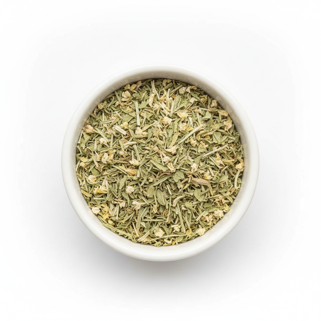 Cut and sifted eyebright herb in a white ceramic bowl on a white background, small mixed green leaf and stem pieces with tiny dried flower fragments
