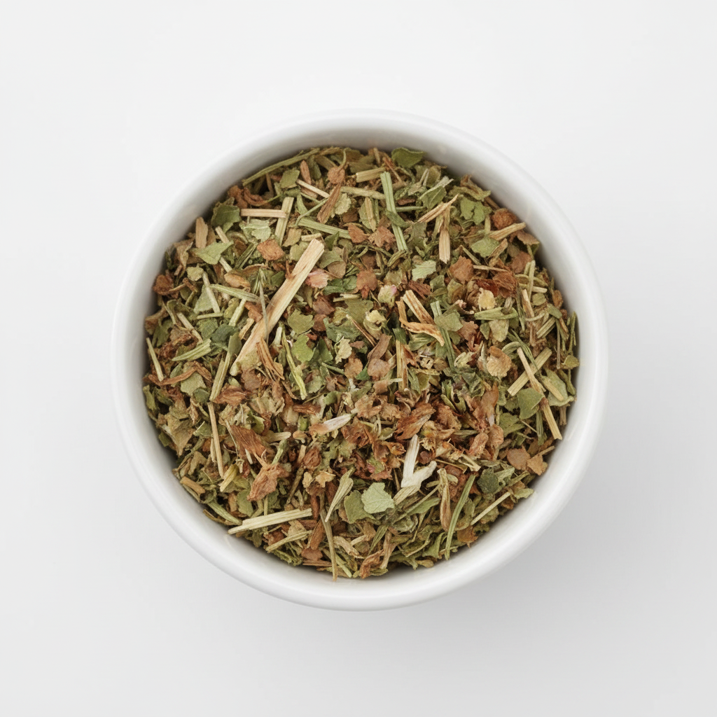 Cut and sifted sheep's sorrel herb in a white ceramic bowl on a white background, mixed green leaf pieces and stems
