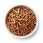 Pau d'arco inner bark cut and sifted thin shavings in a white ceramic bowl on a white background